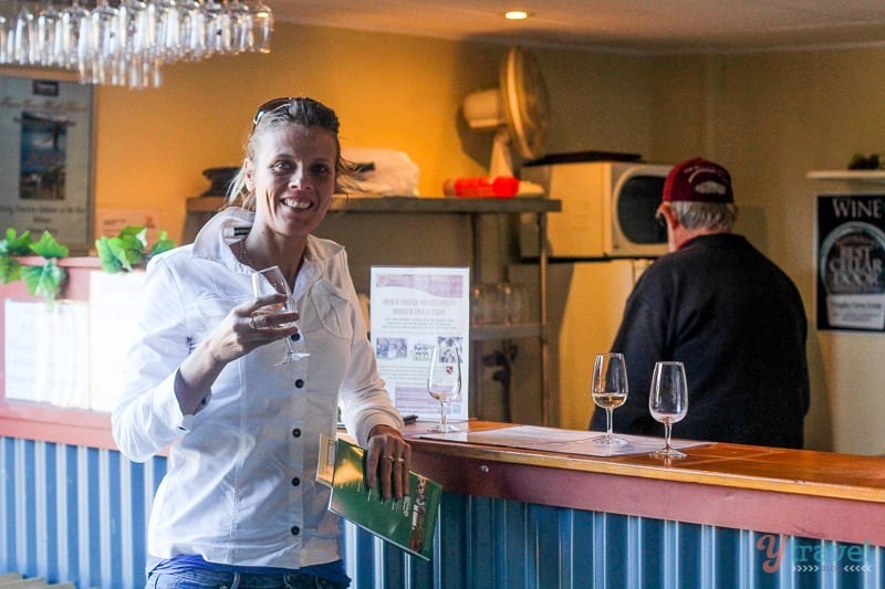 woman sampling wine at the bar at Kingsley Grove Estate