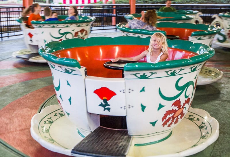 young girl in tea cup