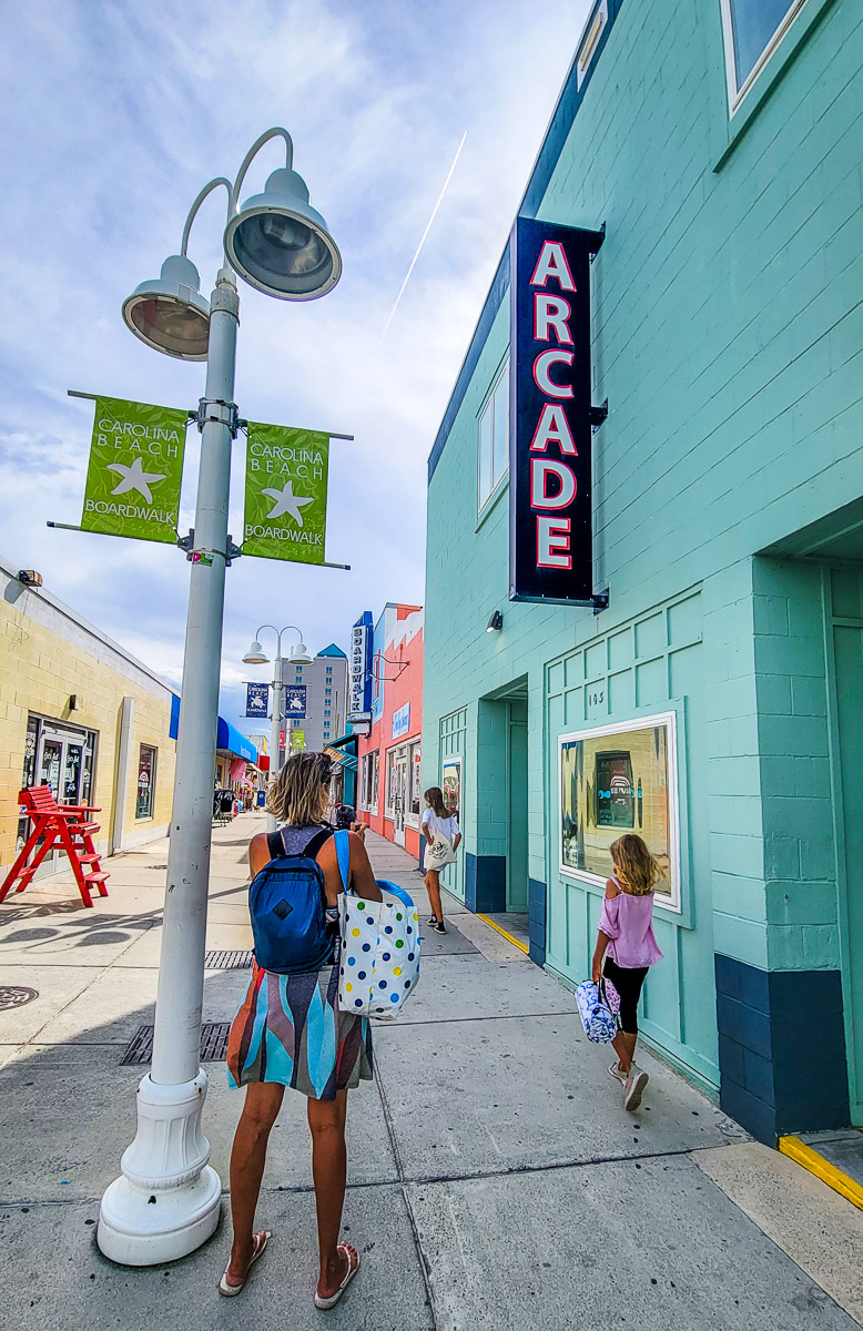 people walking on Carolina Beach boardwalk shops, North Carolina