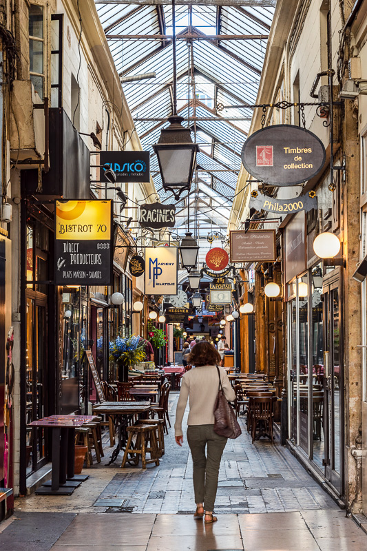 People walking in Passage des Panoramas. It is the oldest covered passage of Paris.