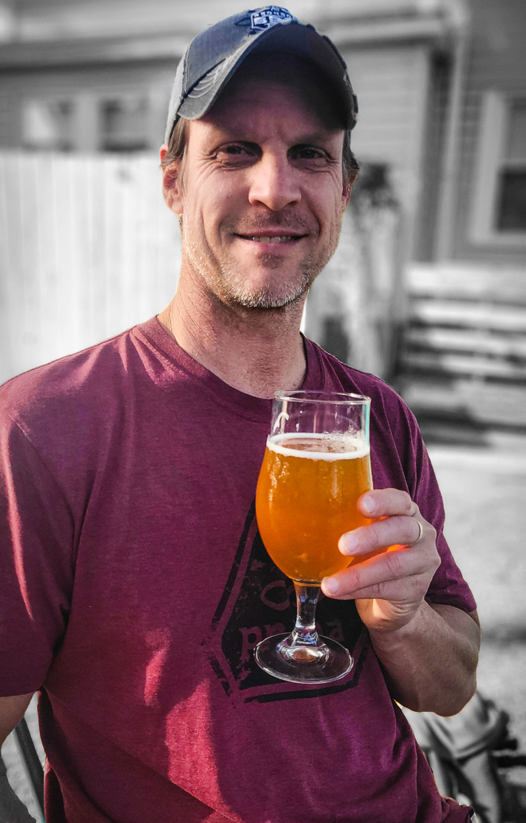 man drinking pint of beer