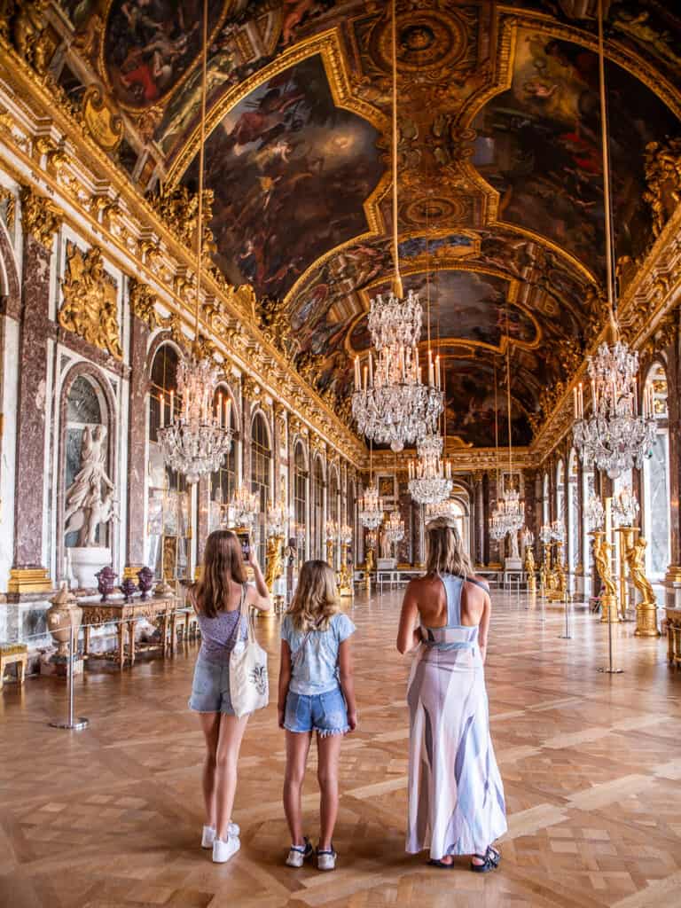 family in hall of mirrors versailles