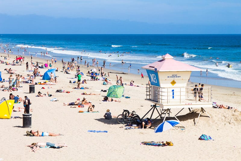 lifeguard station and crowds on Huntington Beach, California