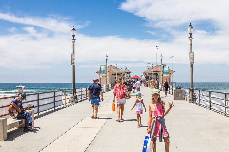 people walking on Huntington Beach Pier, California