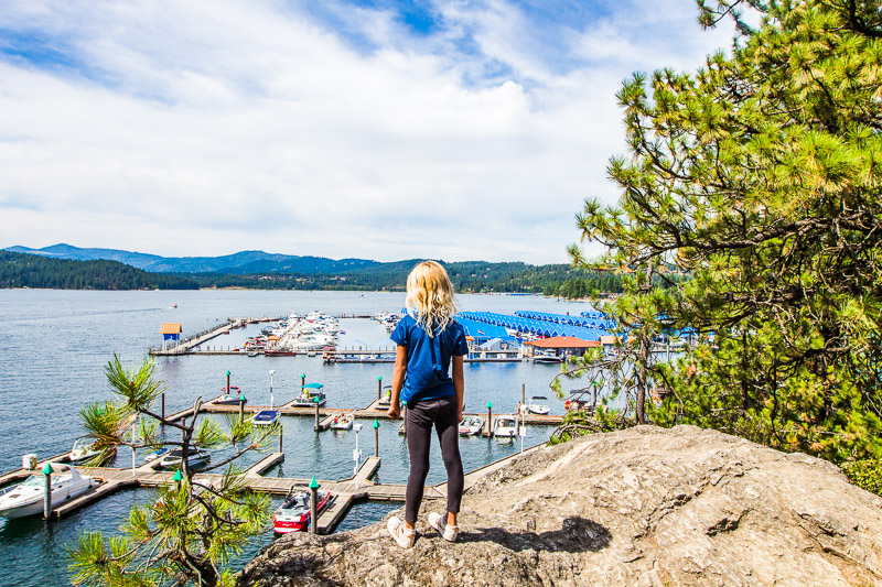 young girl looking at view of lake from Tubs Hill Trail, Coeur d’Alene