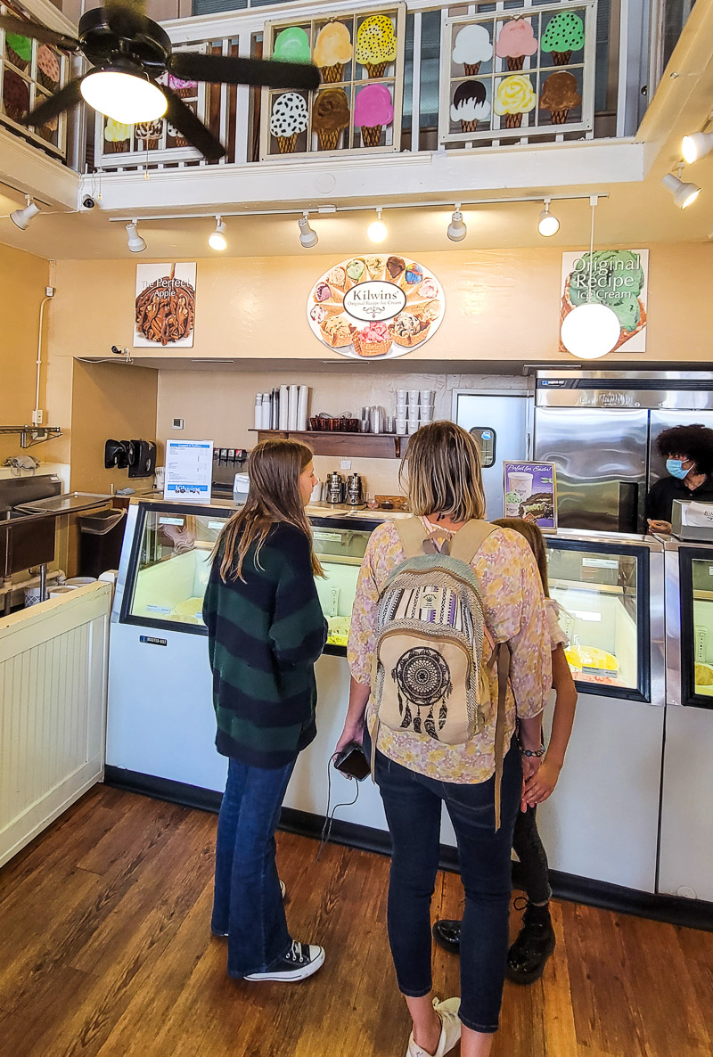 people standing in an ice cream store