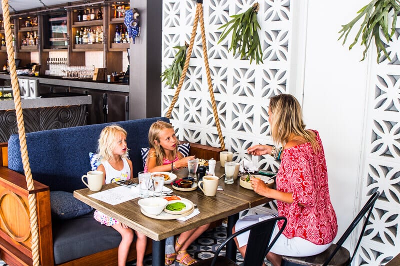 family eating on table at Pacific Hideaway, Kimpton Shorebreak