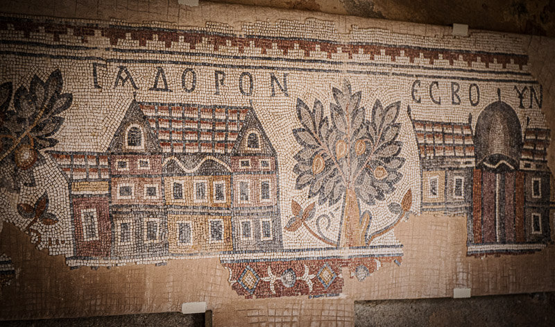 A close up of a brick wall with tile designs