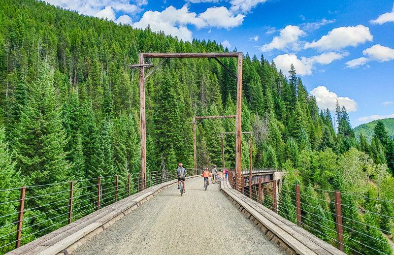 bikers on bridge on Route of the Hiawatha Trail