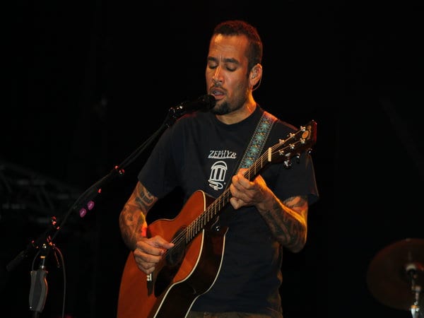 ben harper playing guitar and singing in concert