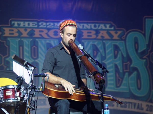 xavier rudd playing instruments on stage