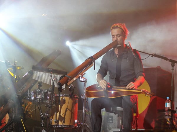 xavier rudd playing instruments on stage