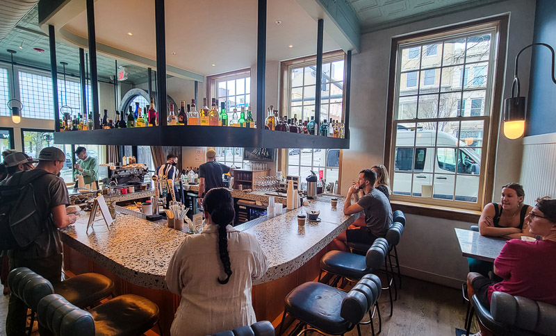 people sitting at a bar