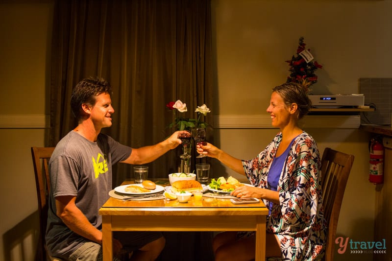 people sitting on a table holding wine glasses