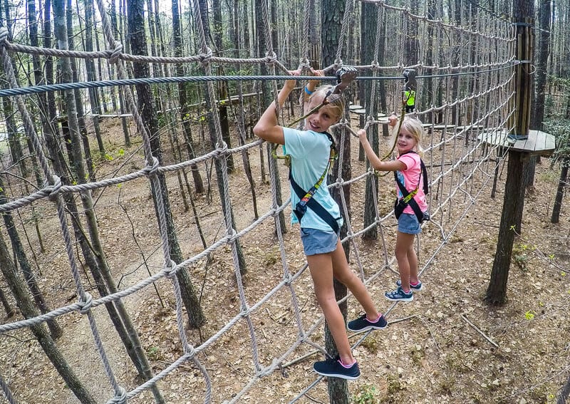 girls on rope obstacle course