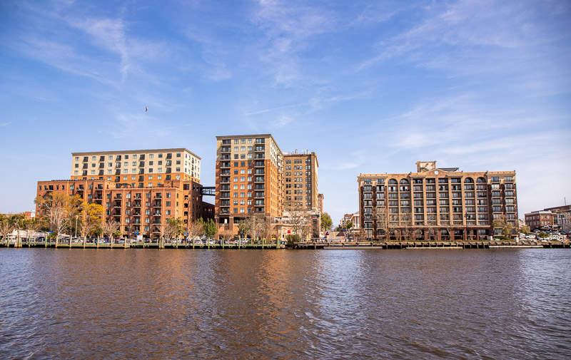 buildings behind a body of water