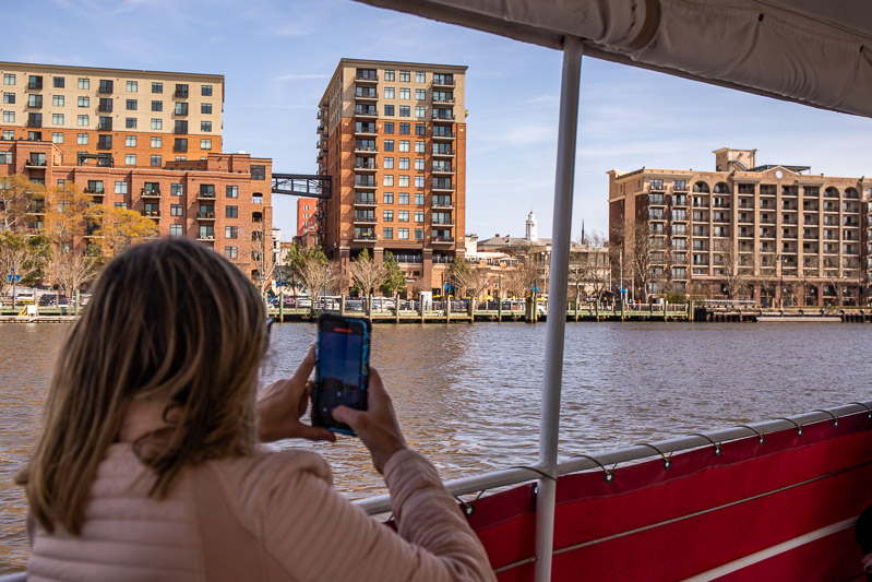 A person sitting on a boat in the water