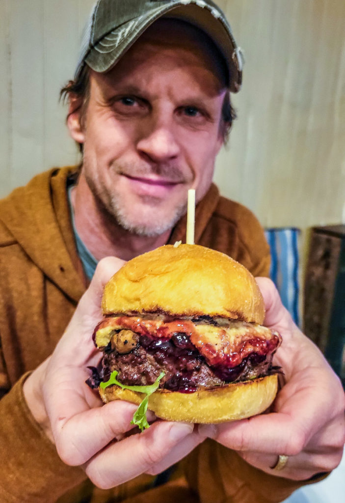 man holding a burger