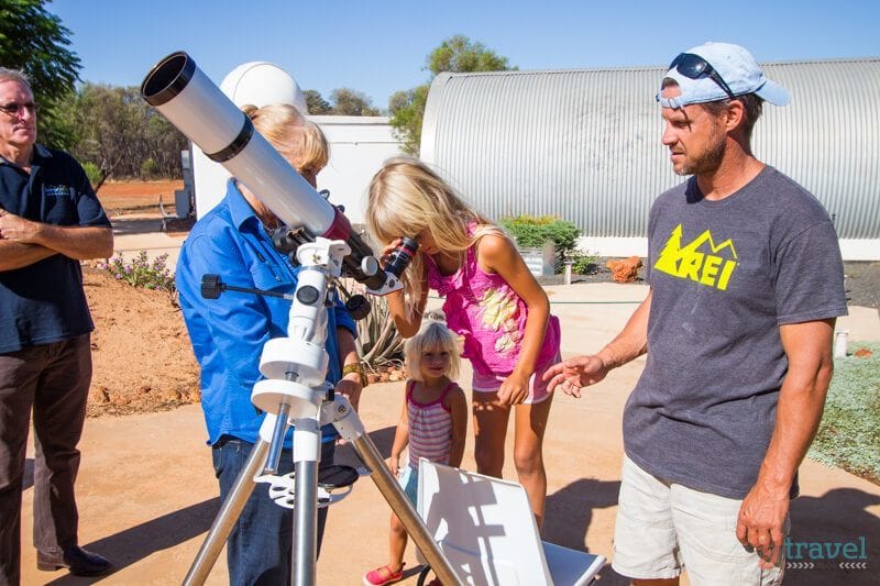 girl looking through sun telescope The Cosmos Centre, Charleville, Queensland, Australia