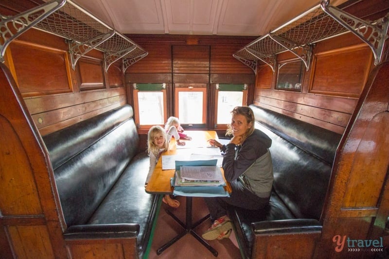 people sitting in a train compartment