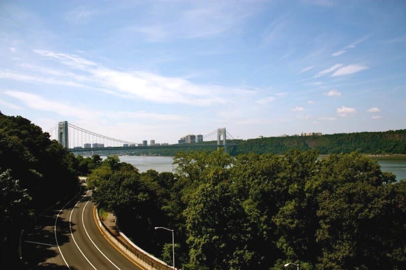 road running through Fort Tryon Park with views of river