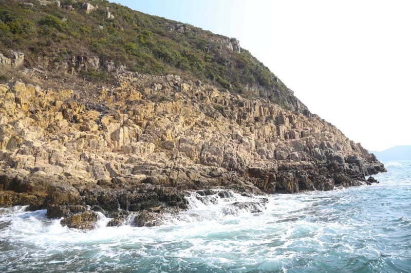 waves crashing up to rock