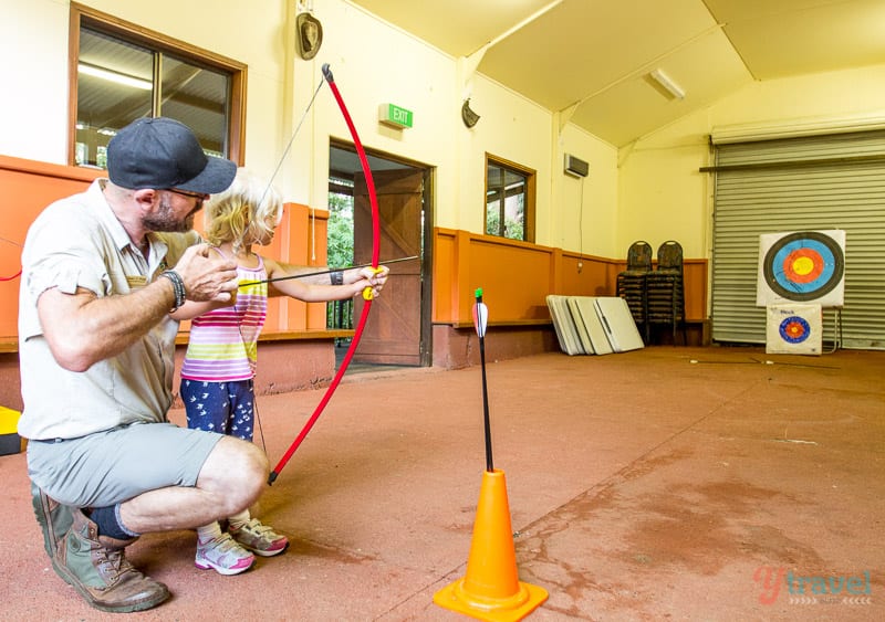 young girl doing Archery at Binna Burra Lodge, Gold Coast Hinterland, Queensland, Australia