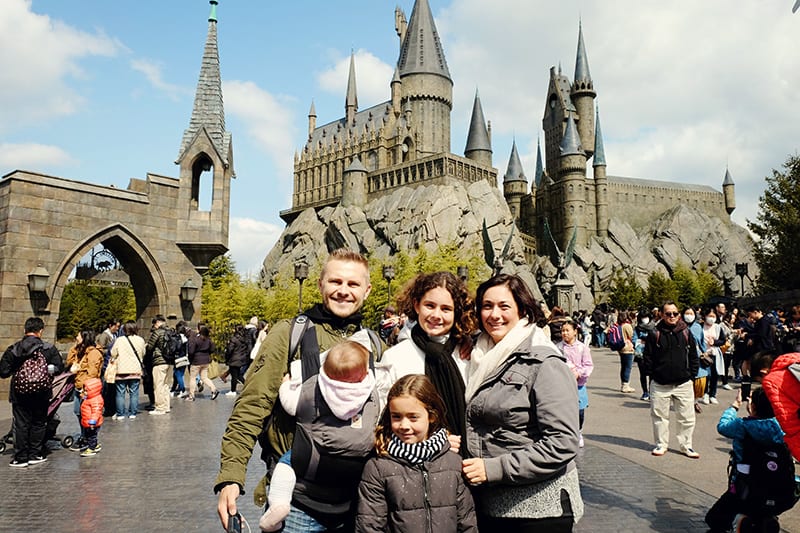 people standing in front of a castle