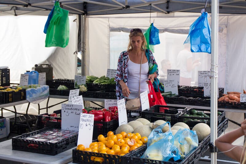 woman looking at food for sale