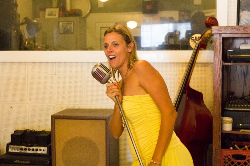 woman singing into microphone