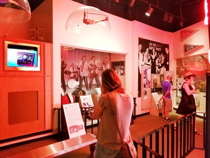 woman looking at Memphis Rock n Soul Museum exhibit