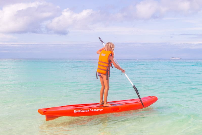 girl stand up paddle boarding