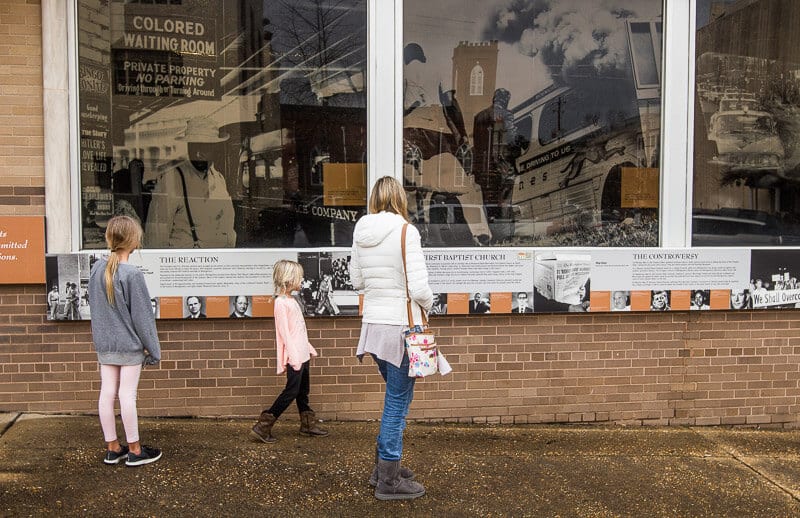 family looking at The Freedom Rides mural