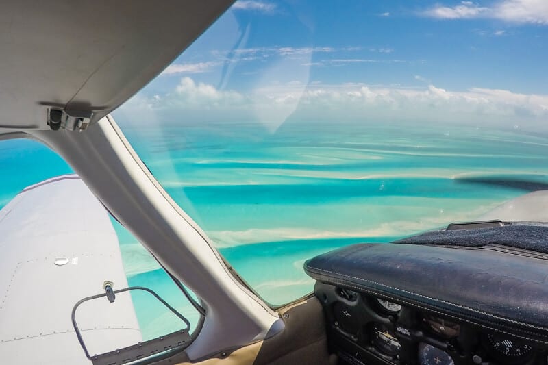 plane flying over the ocean