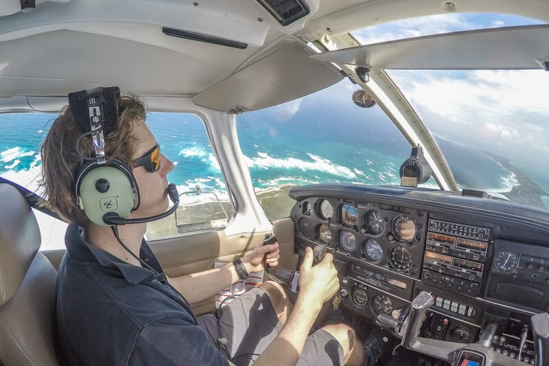 person flying in a small plane