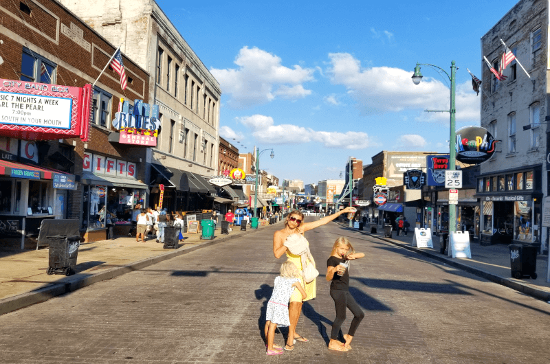 family posing on Beale Street -