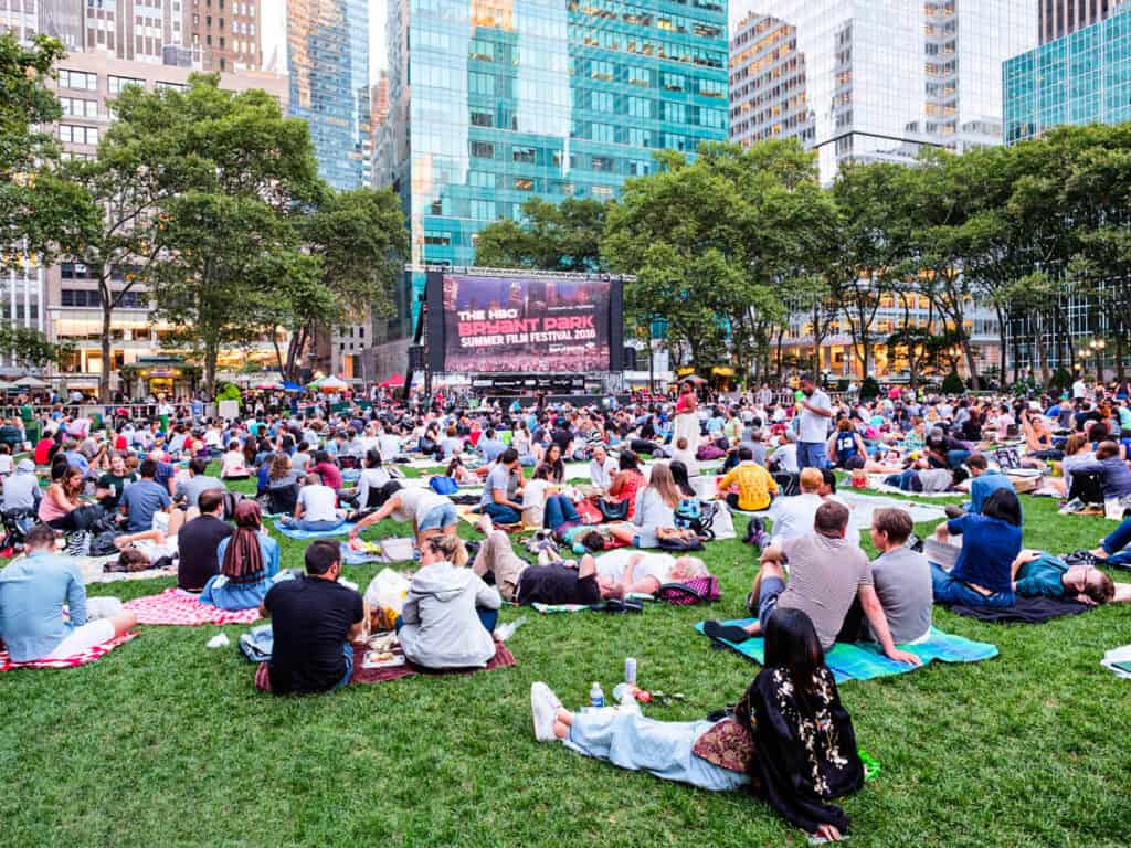 New Yorkers and tourists enjoying the Bryant Park Summer Film Festival