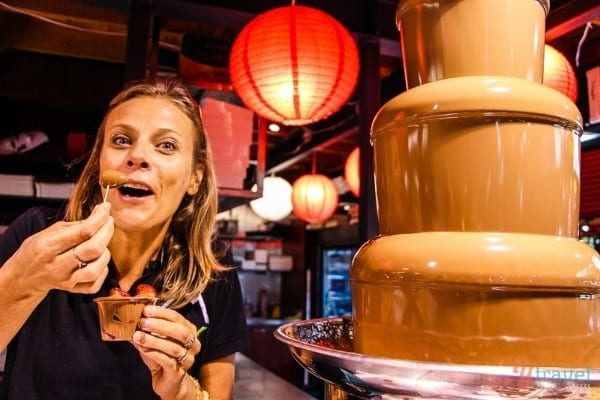 woman beside chocolate fountain