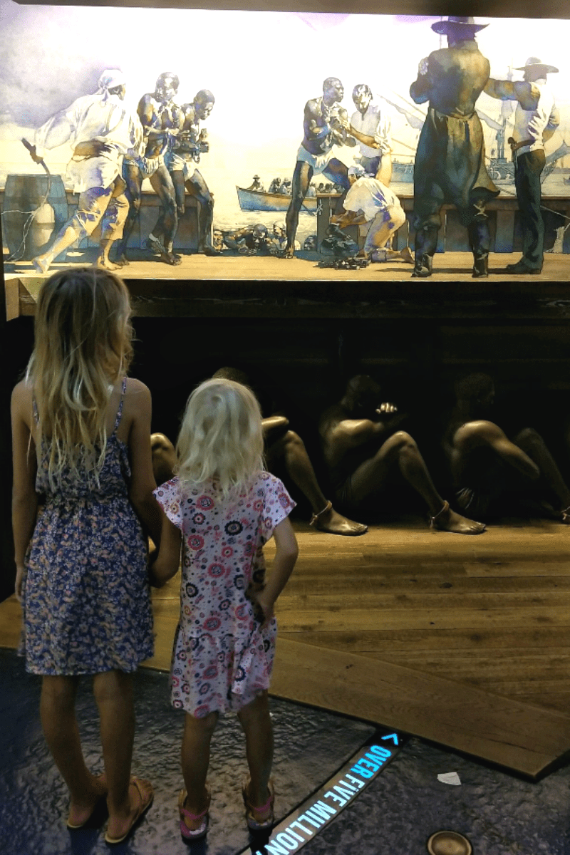 two girls looking at National Civil Rights Museum exhibit