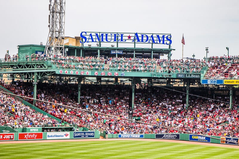 A crowd of people watching a baseball game