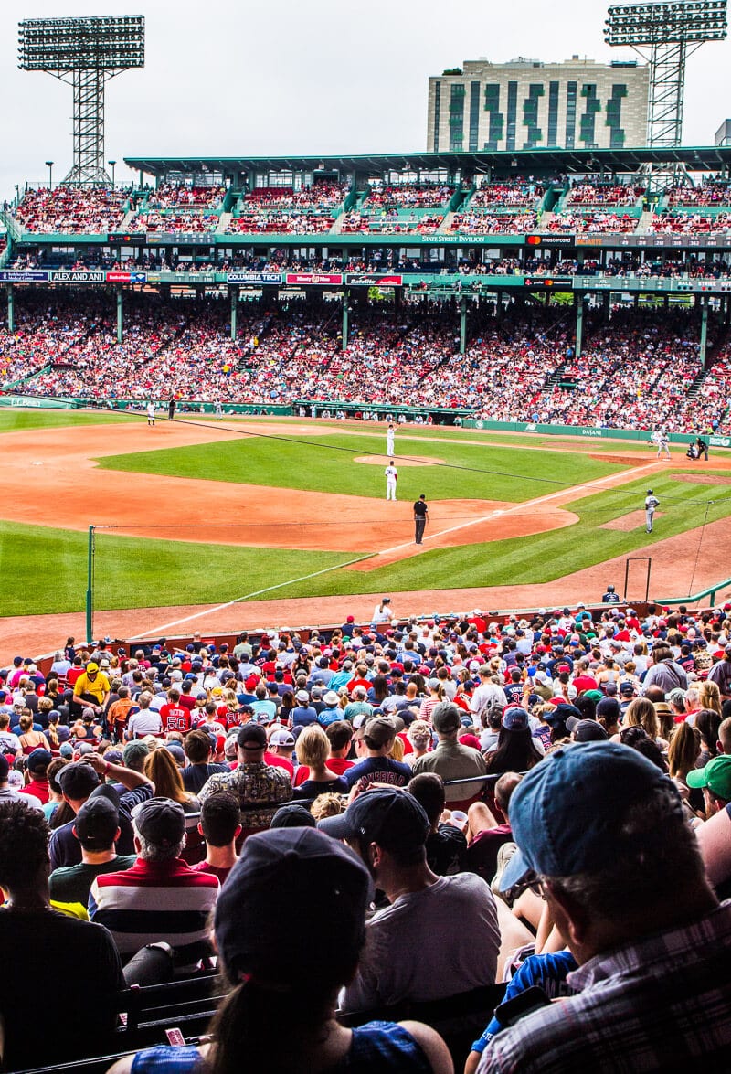 A crowd of people watching a baseball game