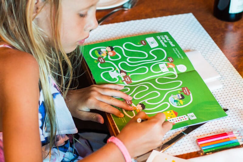 girl looking at a picture book