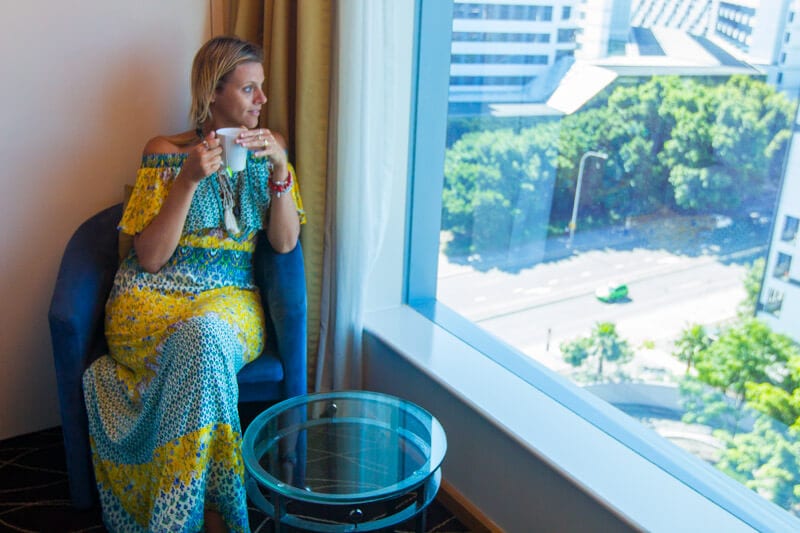 woman looking out a window