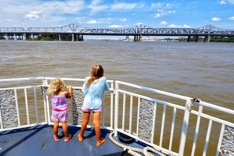 two girls on Mississippi River Cruise looking at water